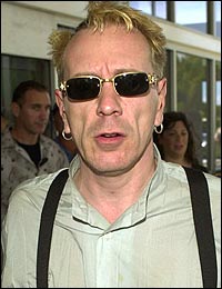 John at Airport in Australia, arriving for I'm a Celebrity Get Me Out Of Here! January 2004 Source unknown 